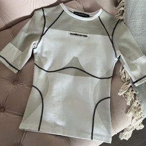 White and grey body contouring top by Maniere De Vior.